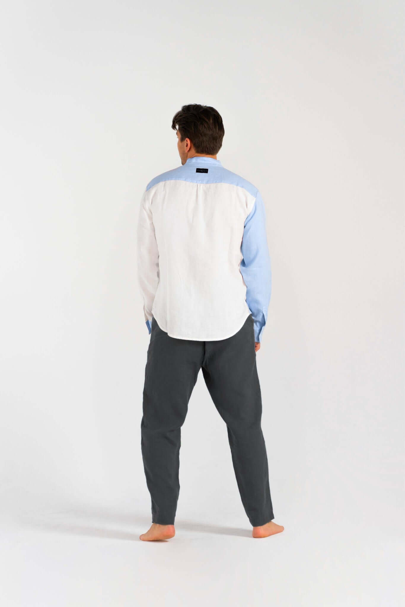 Linen Dual Shirt (Pre-owned) displayed from the back, featuring a unique vertical color division.