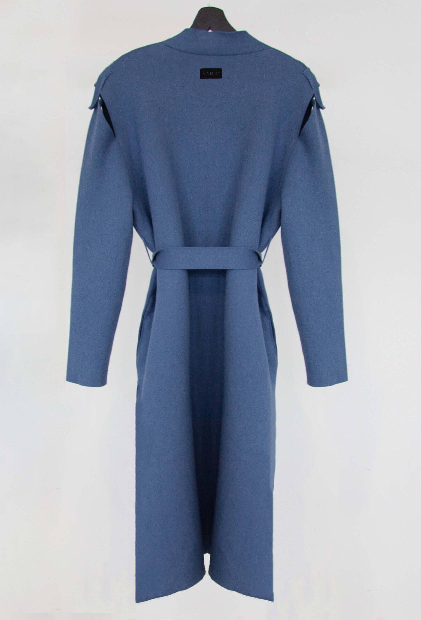 Trenchcoat (Pre-order) in stone blue organic cotton and cashmere, showcasing the back design with a belt.