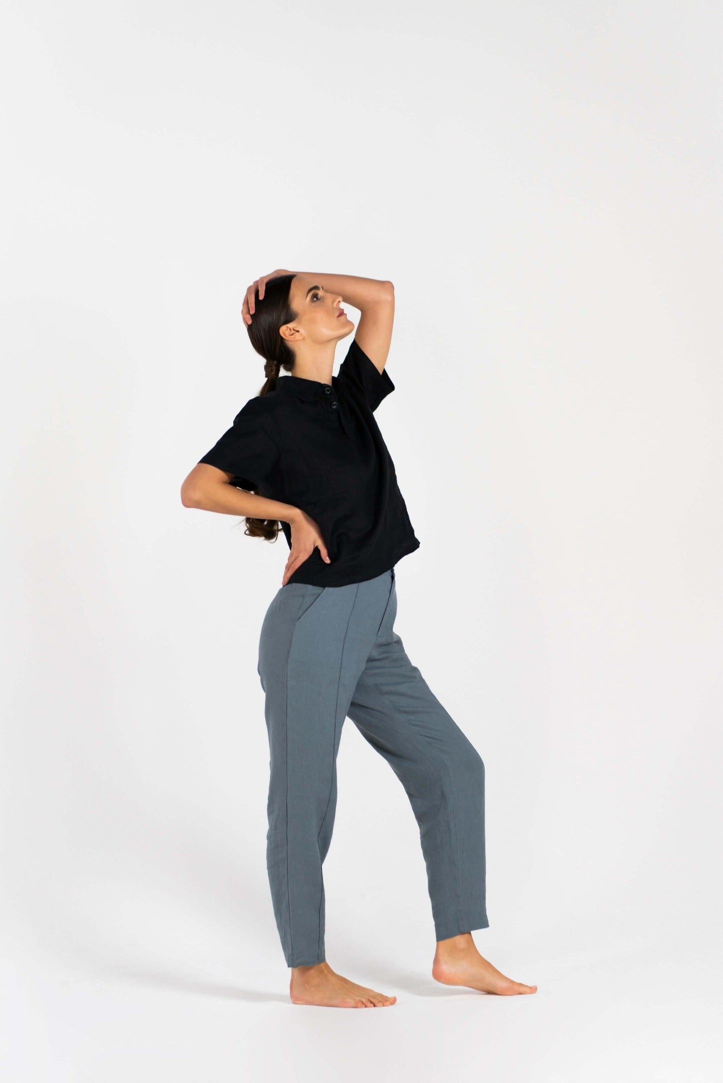 Model wearing elegant Linen Trousers in a relaxed pose, showcasing comfort and style for working from home.