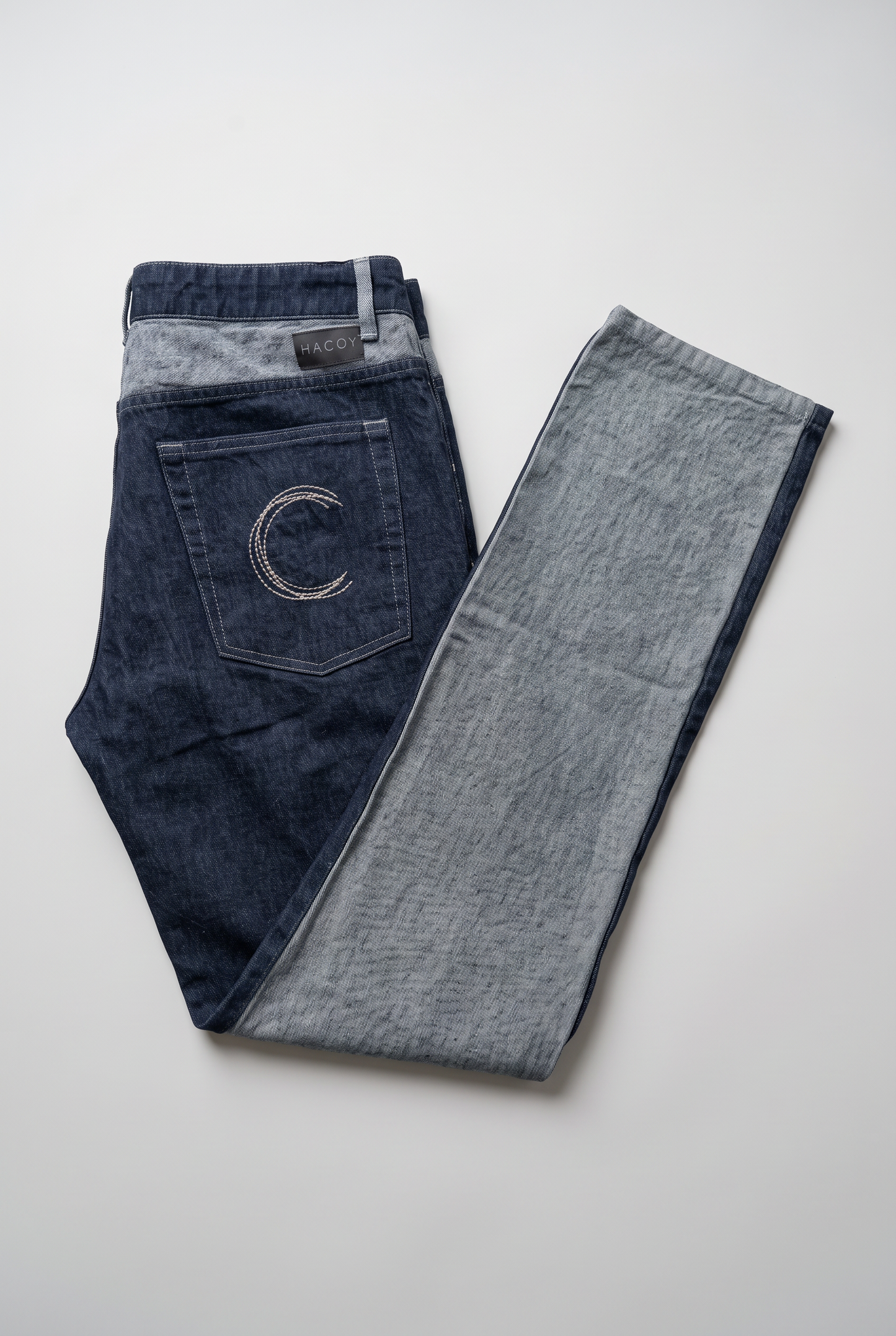 HACOY denim jeans folded, two tone dark blue and grey, monogram pocket