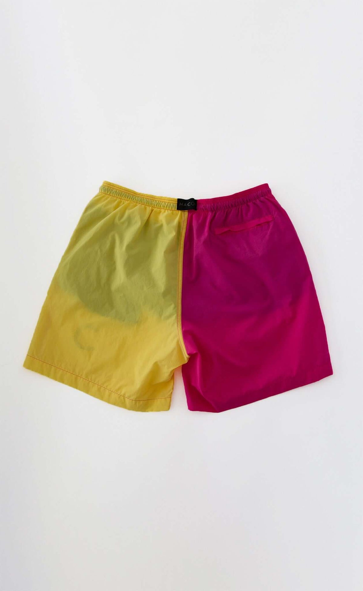 Dual Swim Shorts in a yellow and pink split design, crafted from polyamide.