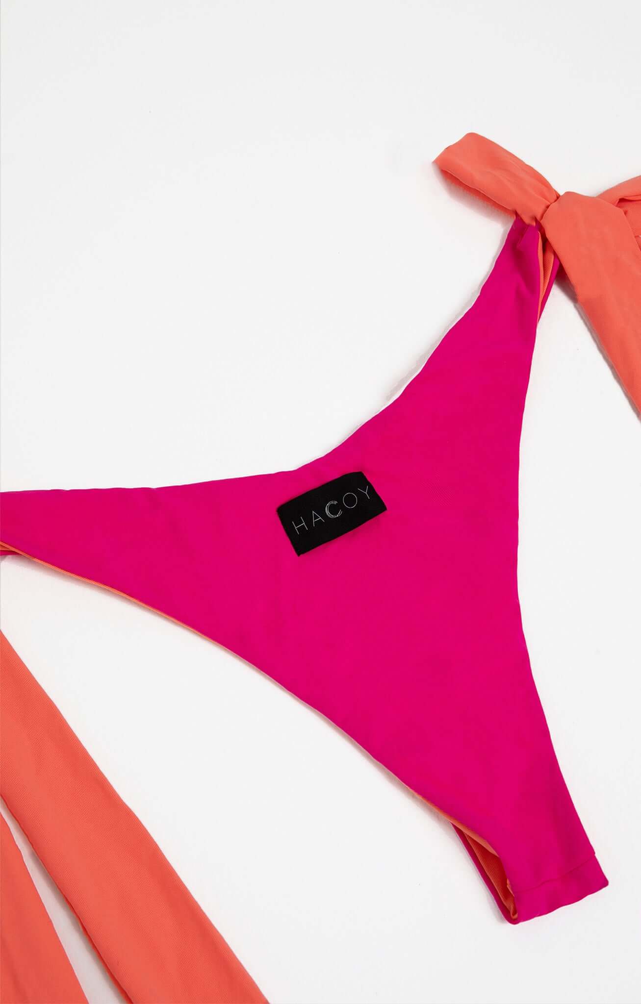 Dual Bikini in bright pink with orange ties, showcasing a triangle silhouette and HACOY label.