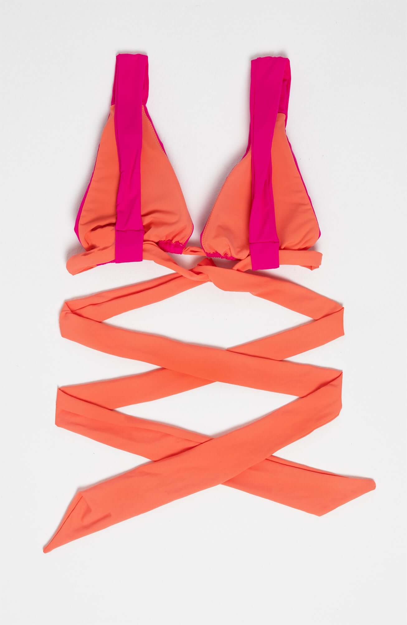 Dual Bikini top in vibrant orange and pink with adjustable ties for a unique beach look.