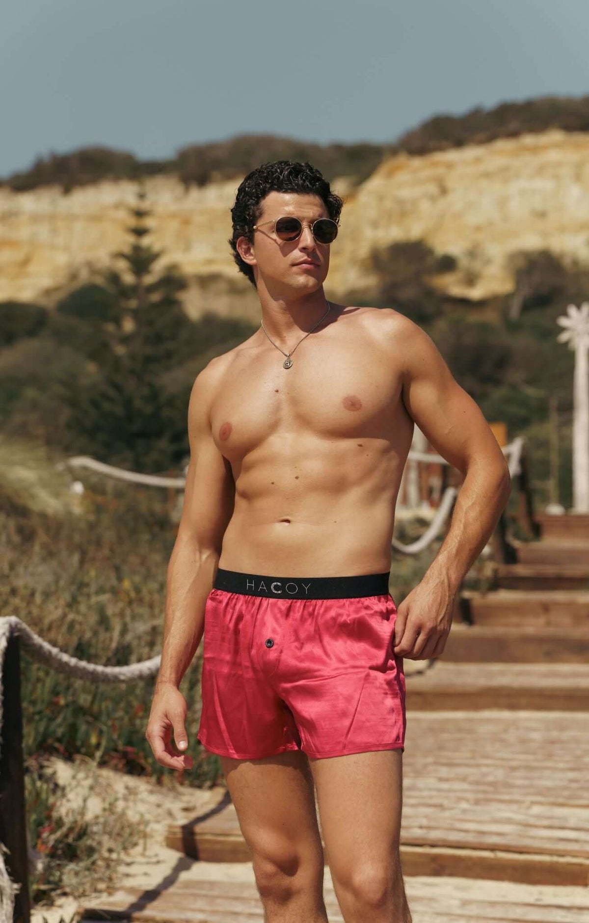 Model showcasing Silk Boxer Shorts on a sunny day, highlighting comfort and style with a relaxed fit.