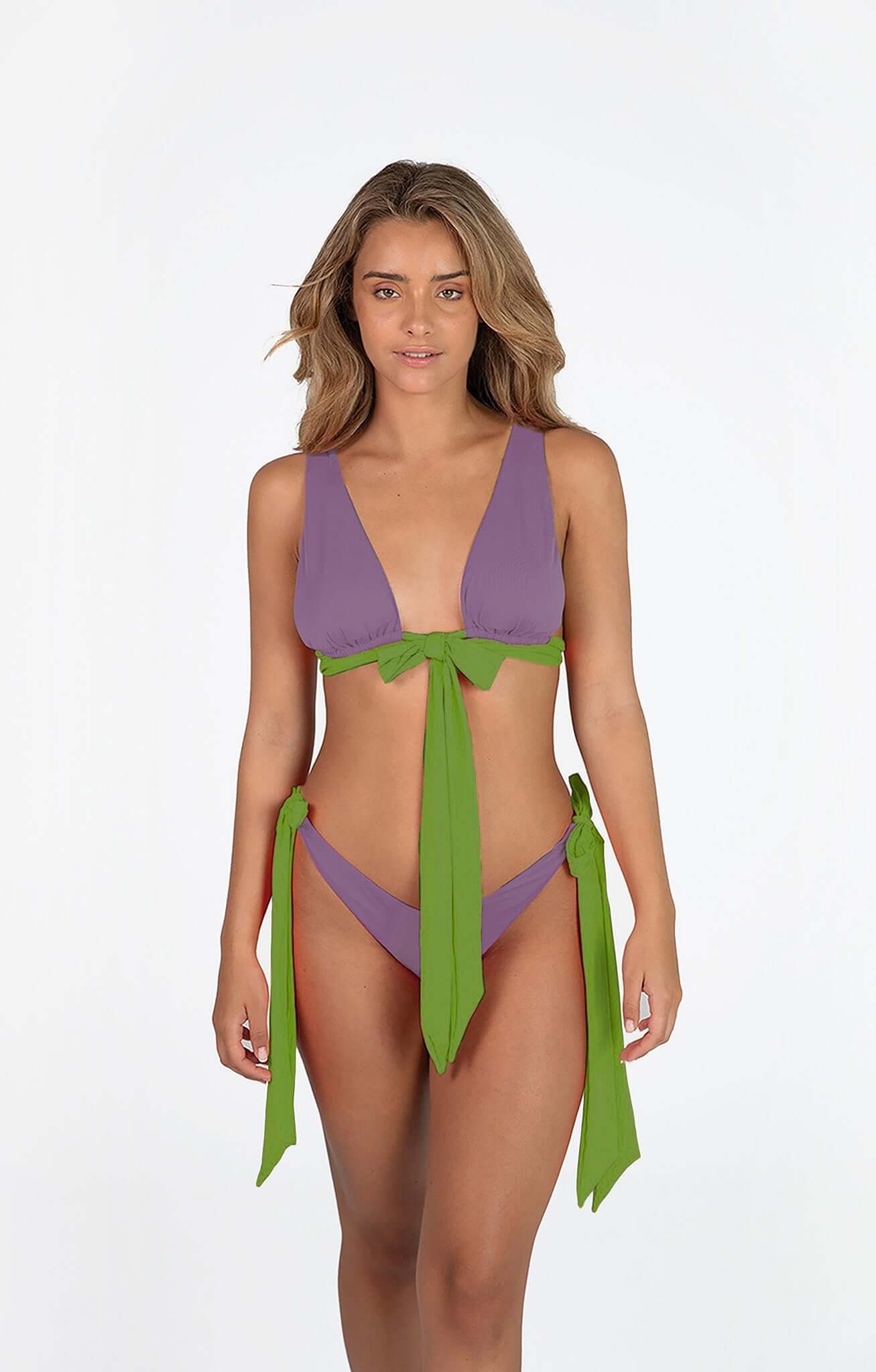 Model wearing Dual Bikini in purple and green colors, showcasing a triangle top and high cut bottom with stylish ties.