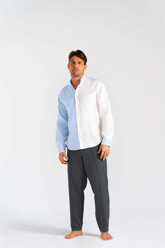 Man wearing a Linen Dual Shirt (Pre-owned) in blue and white, paired with gray pants and barefoot.