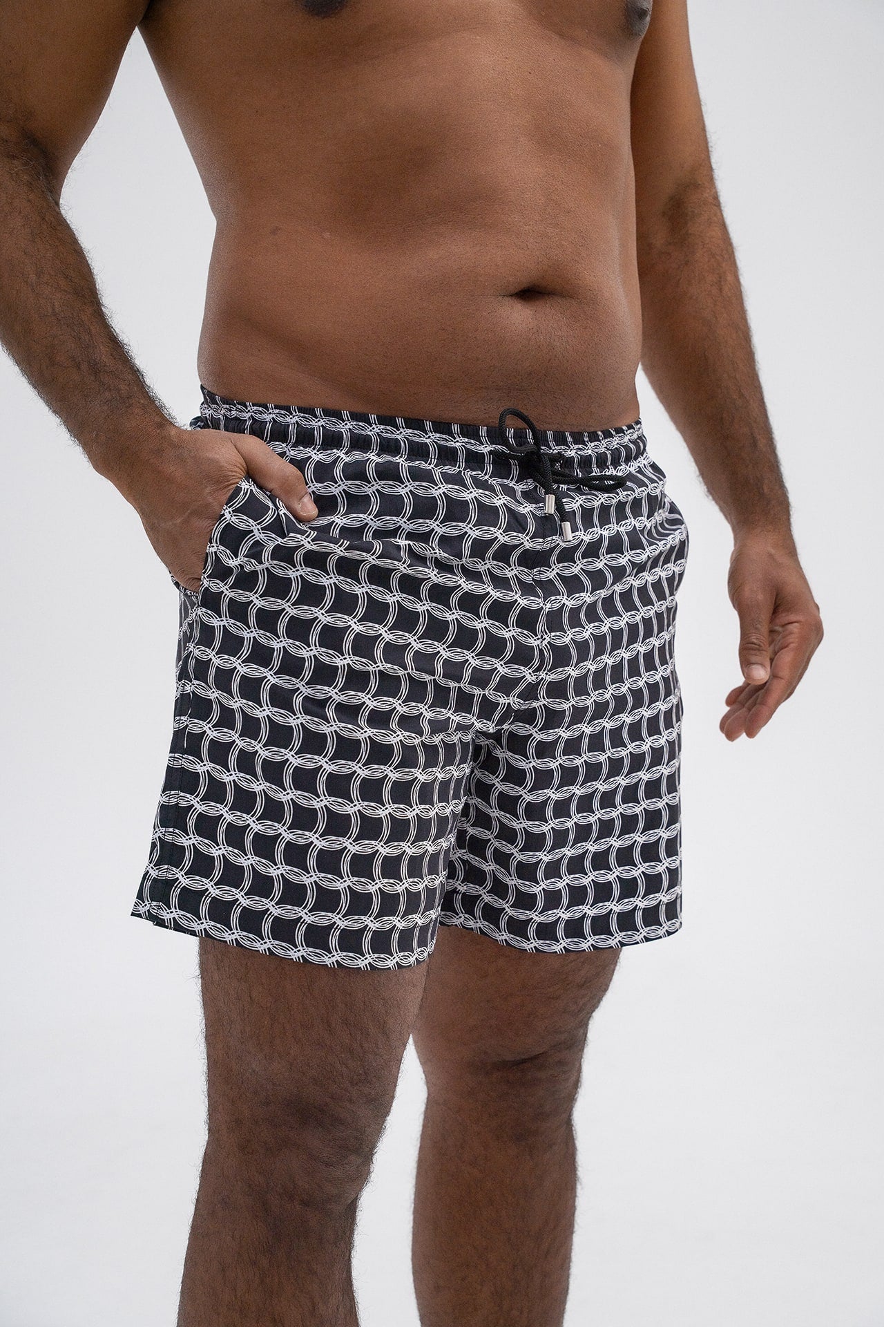 Close up detail of HACOY Monogram Swim Shorts front waistband and drawstring hardware