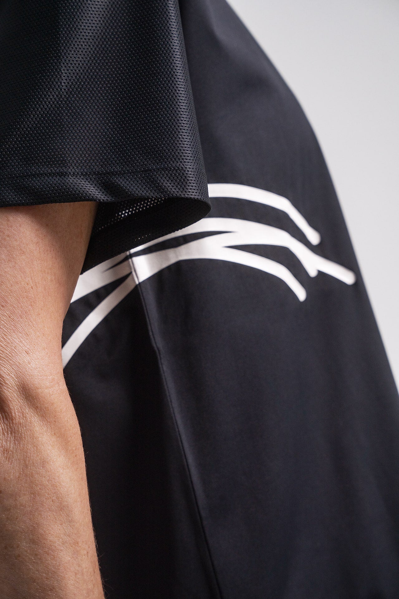 Close up detail of mesh ventilation fabric on shoulder of HACOY Sports Shirt breathable design